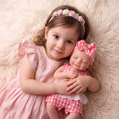 Toddler girl hugging the Lumi doll cheek to cheek