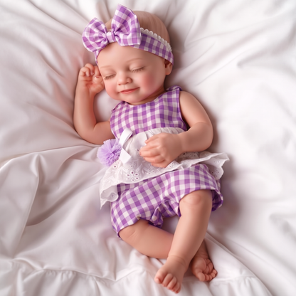 Lumi doll in purple gingham outfit on white bedding