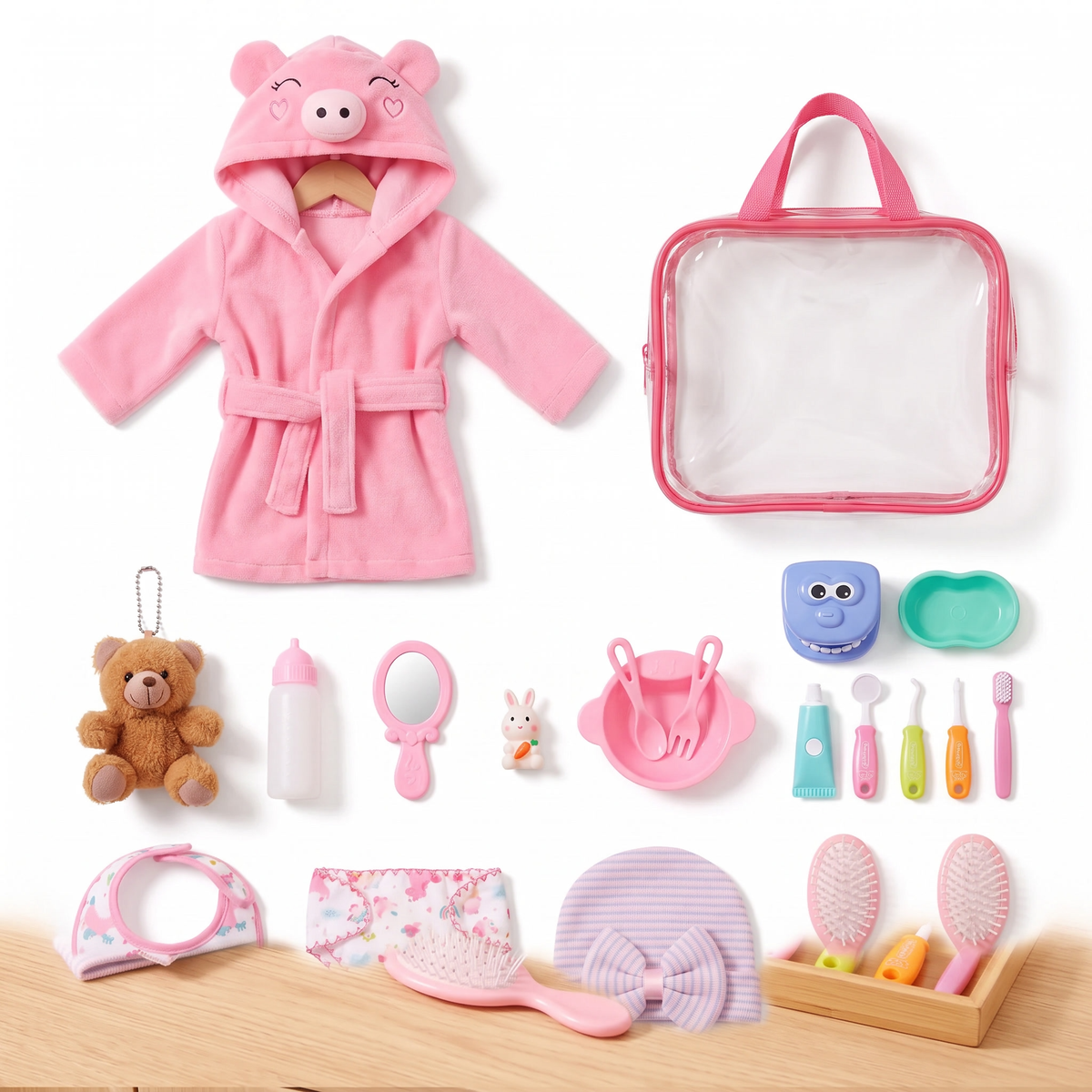 Complete doll care set with piggy bathrobe, carry bag, feeding set, dental play kit and care accessories for 12-16 inch dolls, laid out on white