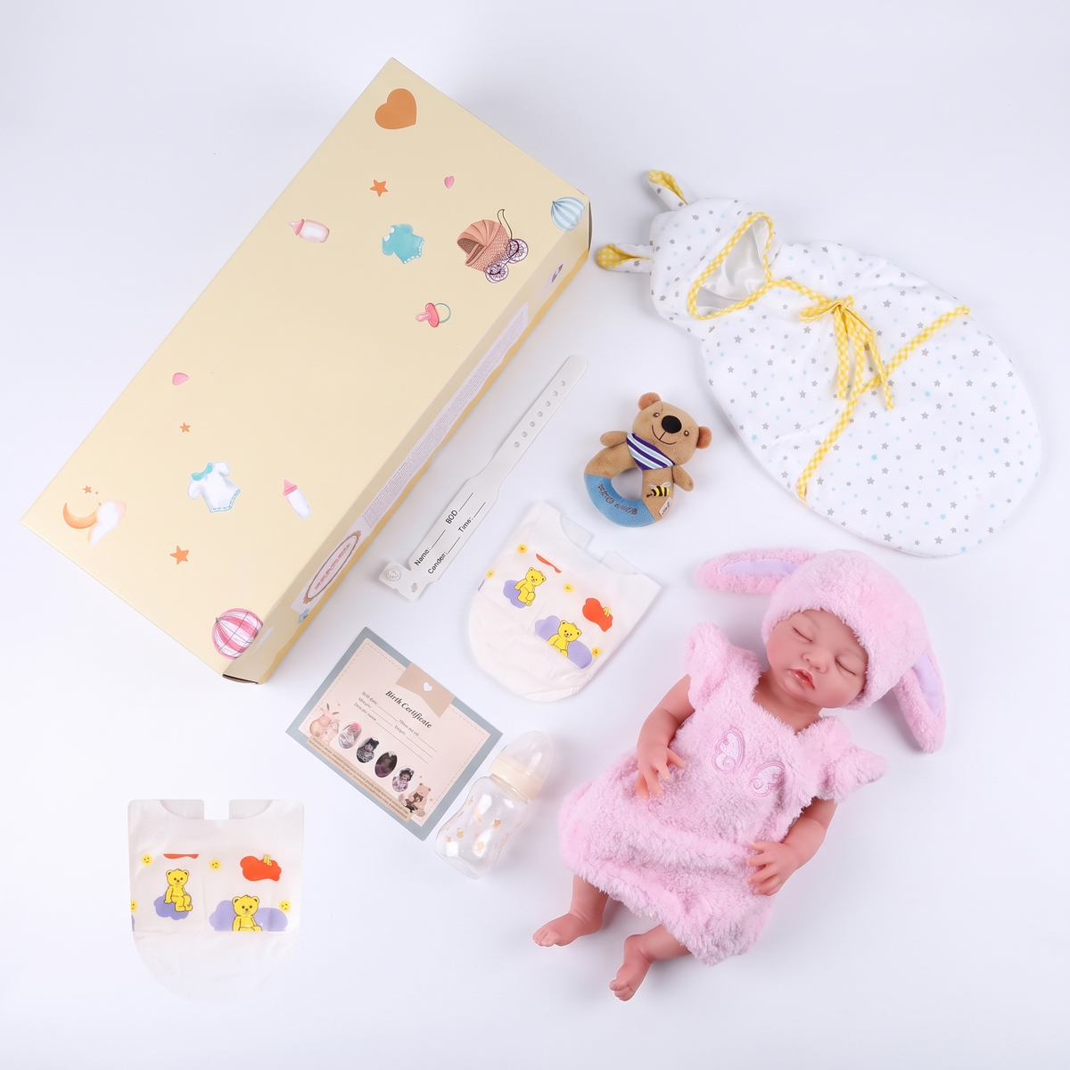 Everything included with Nancy - gift box, swaddle and accessories