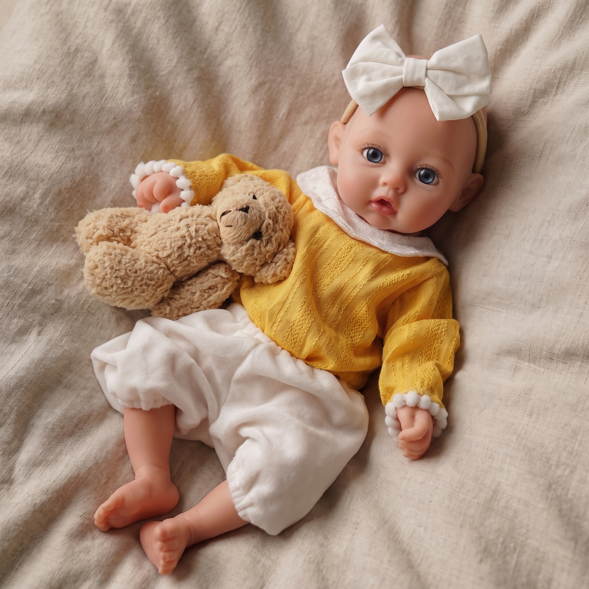 Phoebe doll in yellow knit outfit with teddy