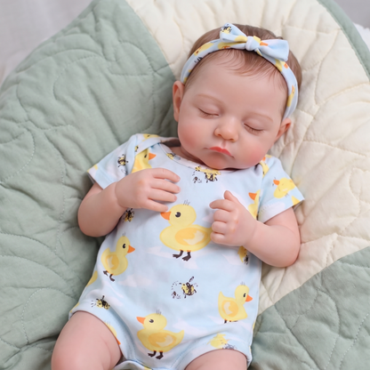 Terry doll sleeping in duck print romper